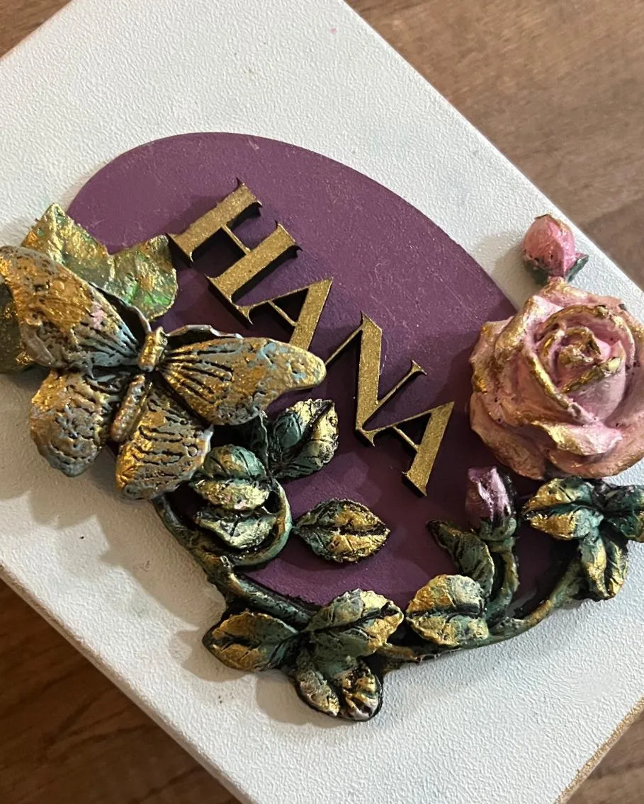Personalized 'Hana' nameplate with butterfly and roses